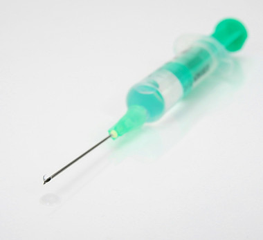 Green syringe close-up