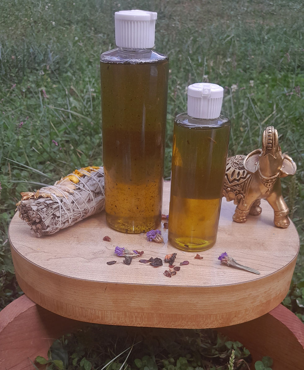 Two bottles Radiant Crown Hair Oil, herbs, and elephant figurine
