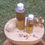 Thumbnail: Two bottles of Radiant Crown Hair Oil, herbs, and elephant figurine