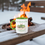 Thumbnail: Winter scene with the Horned Ghost Crab Tea Mug on a snow-covered bench with a firepit burning in the background.