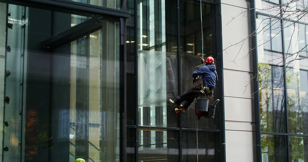 professional-washing-of-exterior-windows-of-skyscrapers-a-man-in-protective-gear-ha-SBV-34