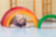 Child crawling throuh arch