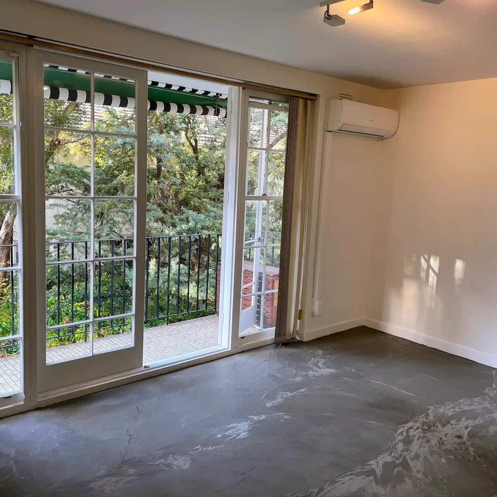 Living space with detailed French sliding doors, vacuumed window tracks, and polished floor surface by Whole Detail. 