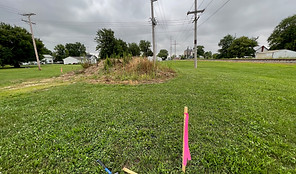 mound of fill with stakes and flagging.jpg