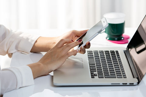 Woman on laptop and iphone.jpeg