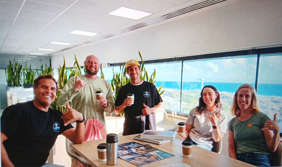Dr Manero (right), Dr Mach (centre) and Kane Holtom (second from left) catching up with the Surfing WA team.