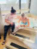 doula and birthing mama with birth tub