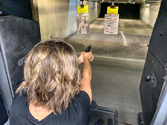 woman-shooting-handgun-at-gun-range_t20_1Qyn4Y.jpg