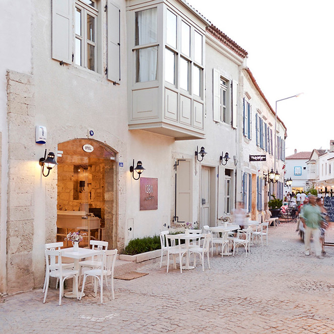 Cozy boutique hotel with warm tones, ambient lighting, and a homelike interior