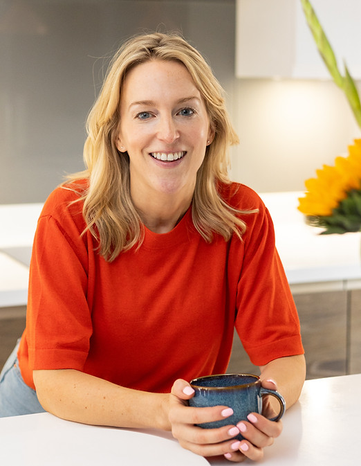 Eleanor Ormiston, Certified Health Coach at Vita Wellbeing, smiling with a mug – helping women over 40 lose weight and boost