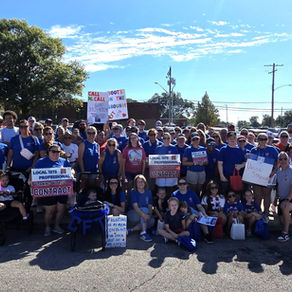 Member of the Cahokia Federation of Teachers rally fair contract during the local labor day parade