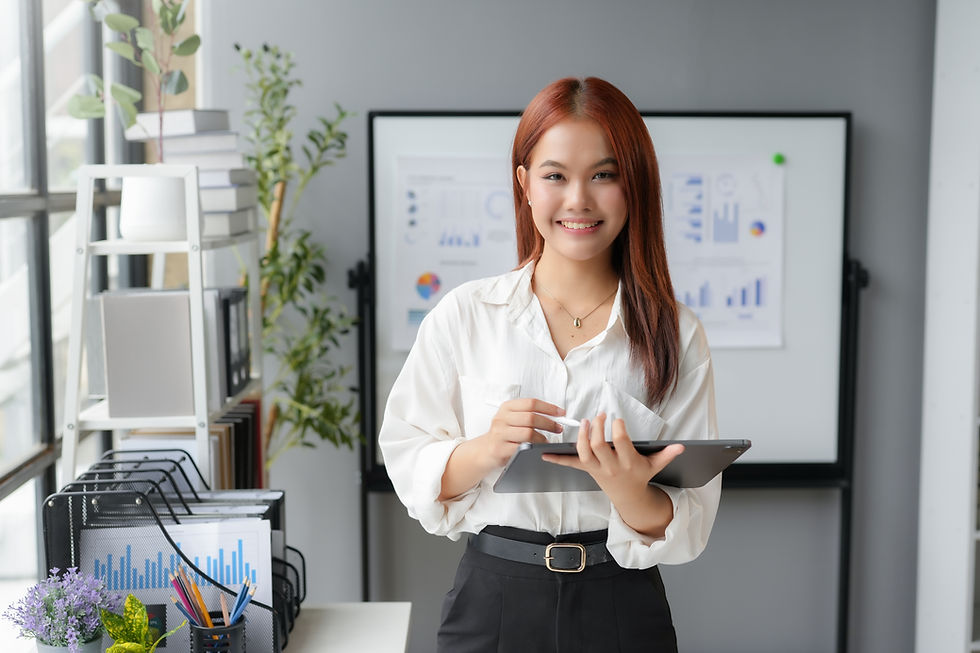 asian-businesswoman-holding-digital-tablet-and-smi-2025-03-08-14-23-37-utc.jpg