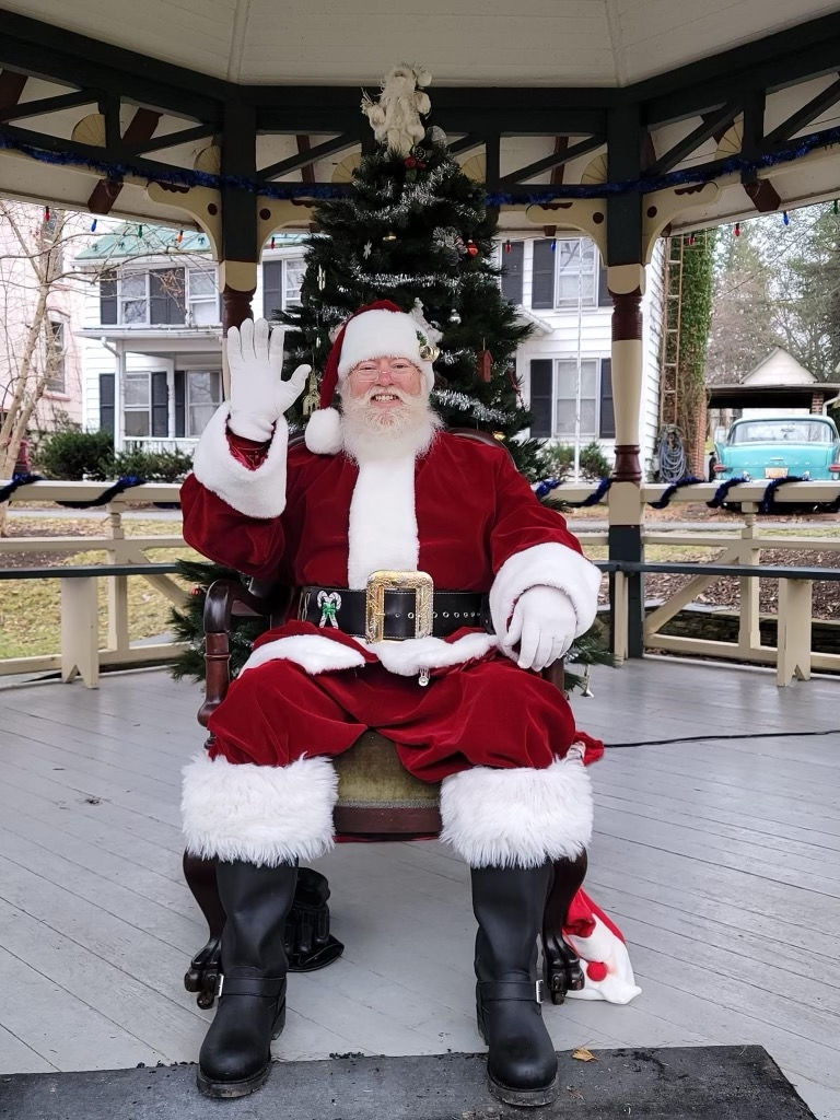 A joyful moment with Santa at a showroom event