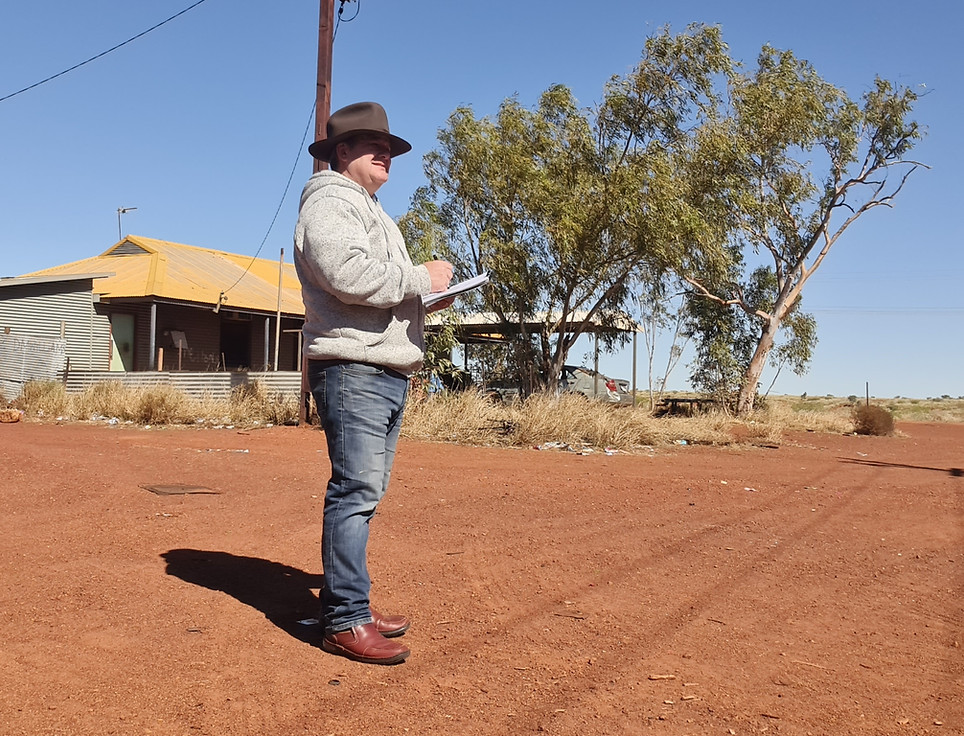 Artist Mark Rusic sketching in remote Indigenous community