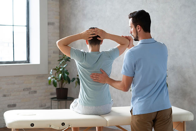 medium-shot-man-helping-patient-physiotherapy.jpg