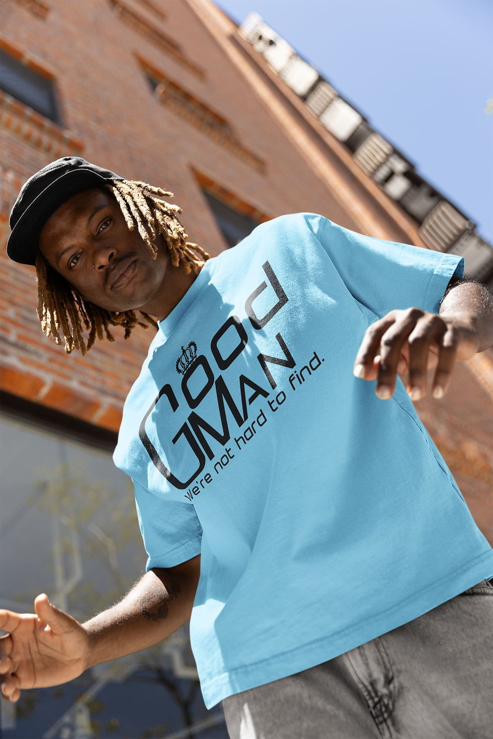 hip-hop-inspired-mockup-of-a-man-wearing-an-oversized-t-shirt-in-front-of-a-building-m3925