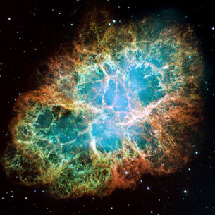 A complex and multicolored cloud in space.