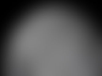 The Moon as seen by Artemis II. At the center of view is a large round crater with a dark patch at its center.