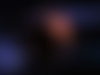 A planet and to of its moons, one big and one small, with a small red star as its sun.