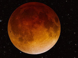 The full moon glows an eerie red during a lunar eclipse.