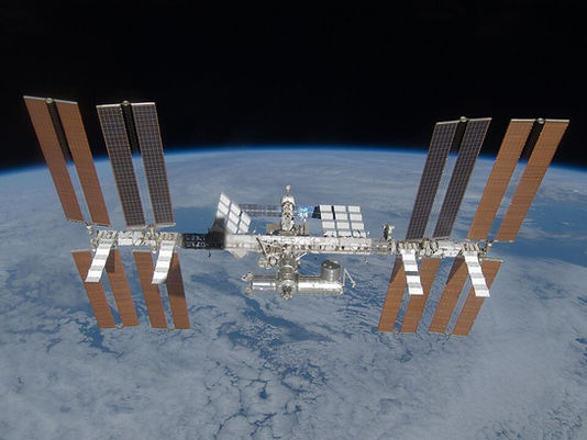 The International Space Station above the Earth.