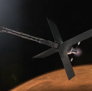 A long spacecraft arrives above the planet Mars.