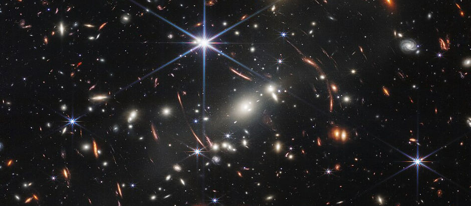A myriad of galaxies captured in a single deep field image. Some of them are stretched and distorted by the gravity of massive objects.