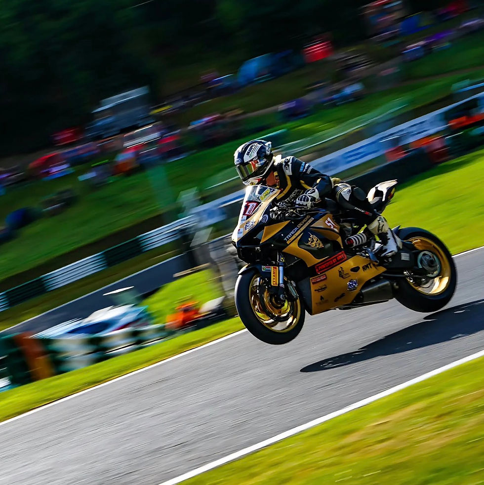 OneX Australia motorcycle racer airborne on track