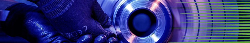 Technician sanding metal rotor on lathe for precision machining and reverse engineering