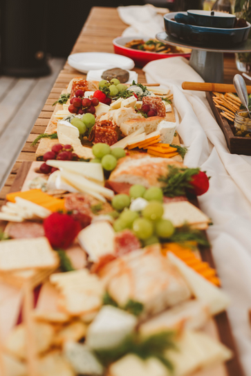 a long charcuterie grazing table