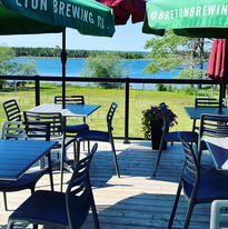 Outdoor patio dining by the ocean at The Groundswell