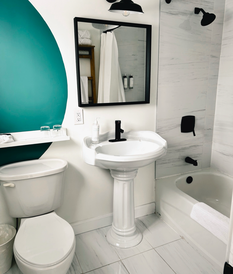 bathroom in the At The Beach queen room in the marmalade motel