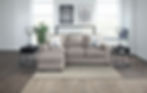L-shape light colored couch in living space