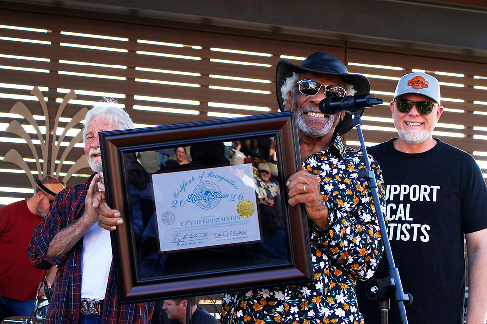 Mac Arnold holding certificate