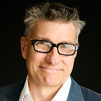 executive coach headshot blue jacket