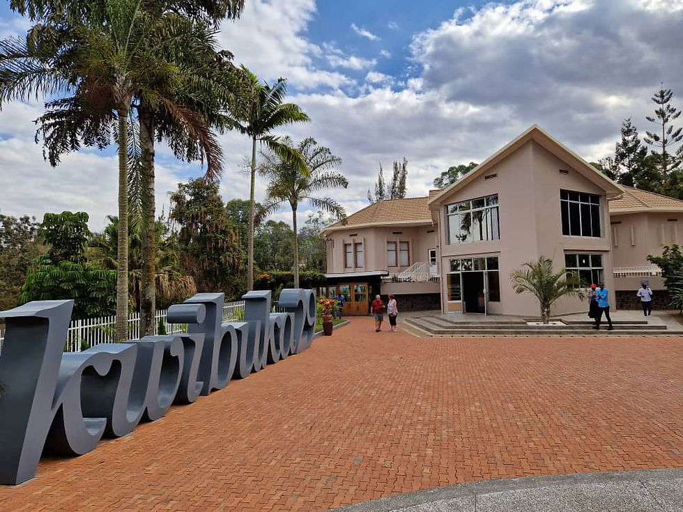 Eye-level view of the Kigali Genocide Memorial surrounded by lush greenery