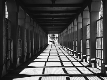 Covered footbridge overpass in black and white