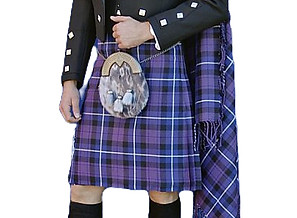 A man dressed in highland dress with kilt