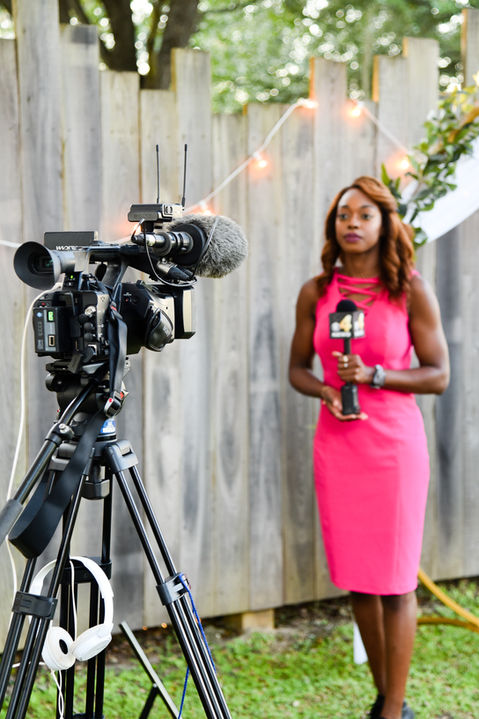 Image of news reporter at Guest Chef event.