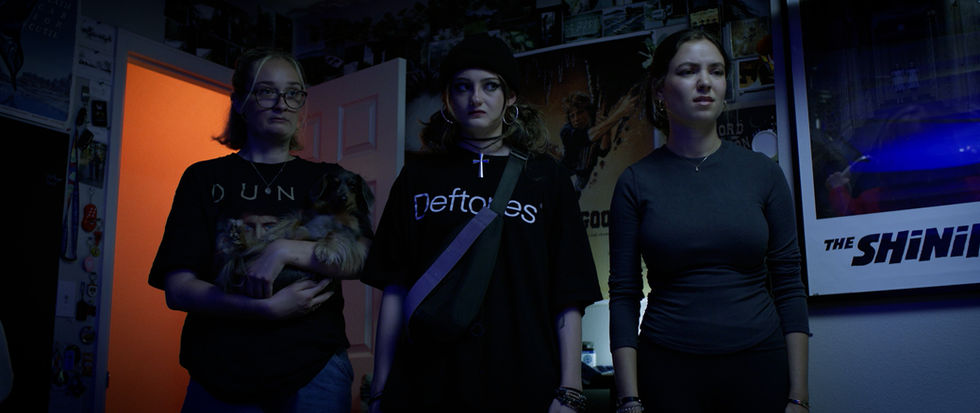 a woman wearing a black shirt that says deftones