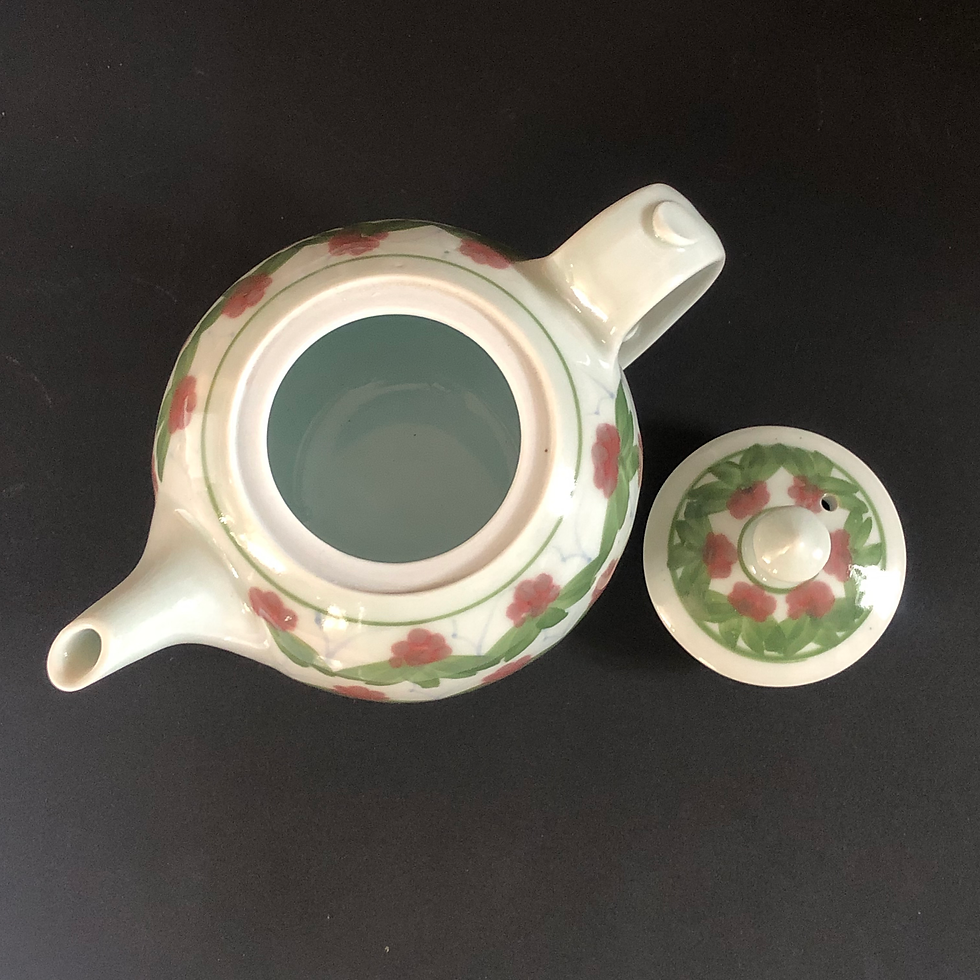 Thumbnail: a teapot with a clear glazed interior by studio potter Derek Emms.