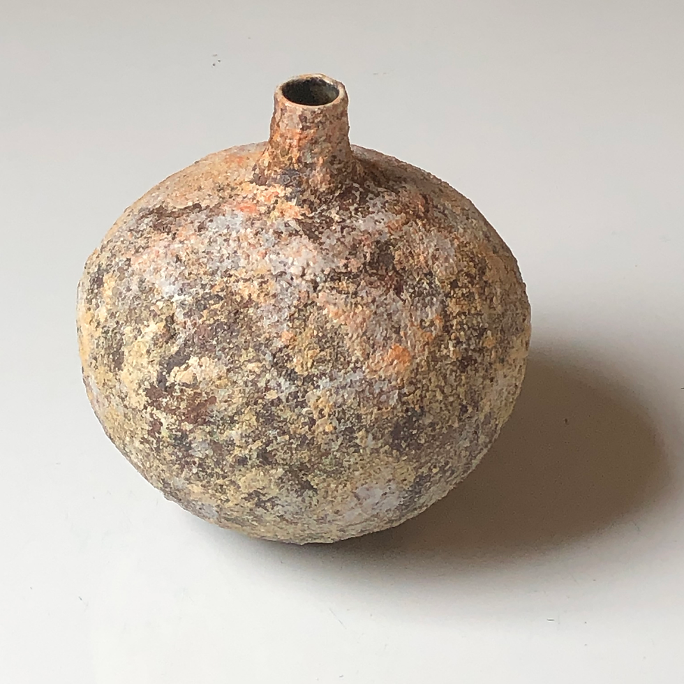 A narrow necked stoneware bottle by Philip Evans potter
