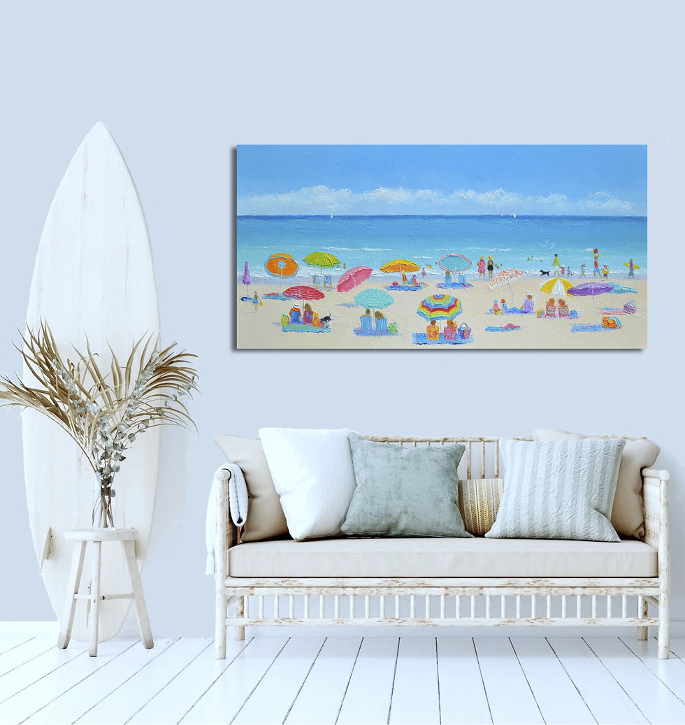 Coastal room mockup showing Jan Matson’s busy summer beach painting above a light-wood sofa on a light blue wall, beside a surfboard.