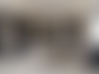 High-end primary suite featuring a luxury living room with marble flooring and expansive windows for natural light.