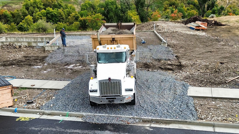 Black Mountain Rock truck placing gravel into a new home foundation at Bear Lake, Utah