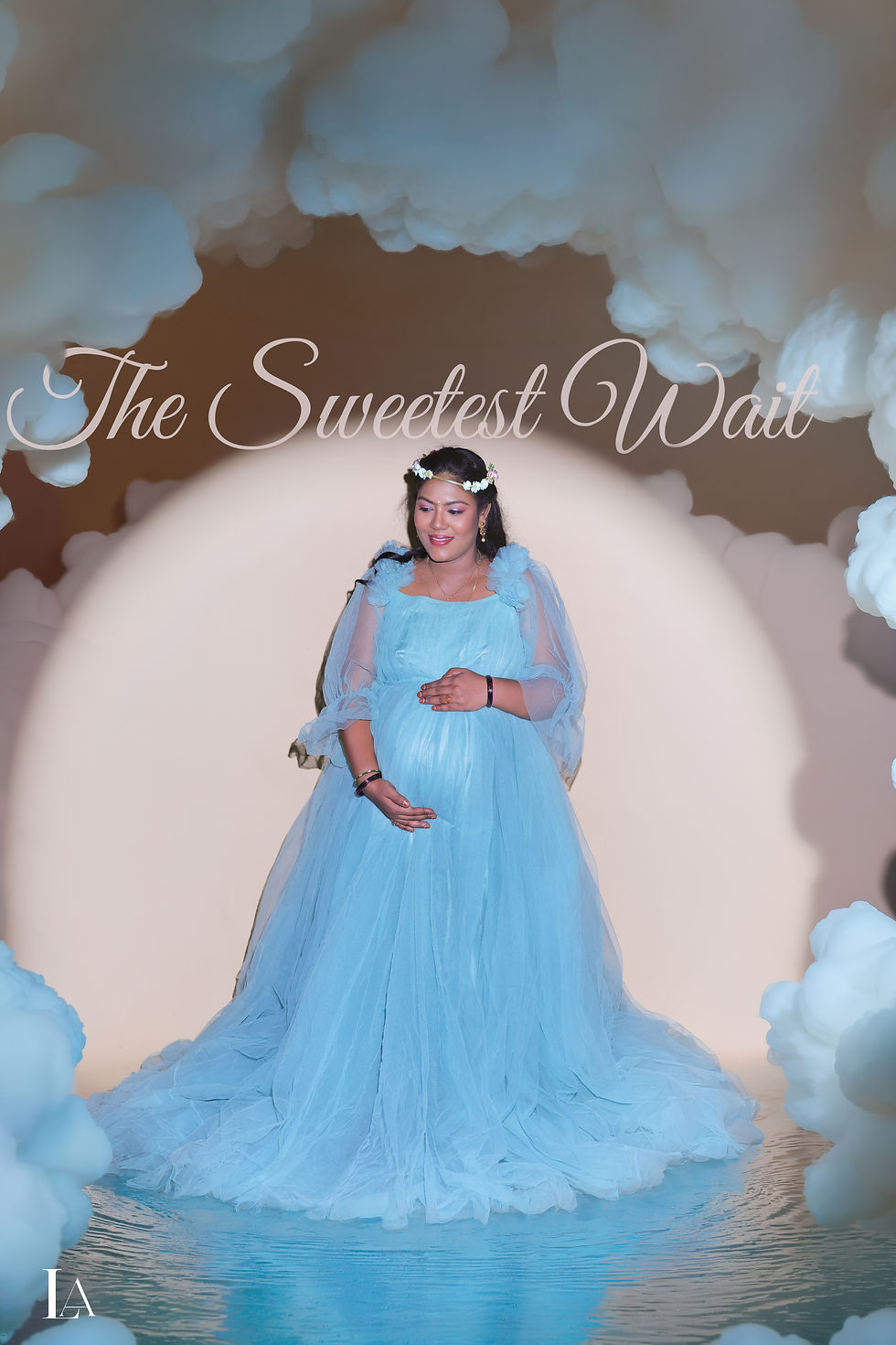 Expecting mother in a blue gown during a dreamy maternity photoshoot in Visakhapatnam