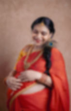 South Indian traditional maternity photoshoot of a pregnant mother in saree, captured by LensAction Photography in Vizag.
