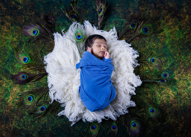 Krishna theme newborn baby photoshoot with props – best baby photography in Visakhapatnam