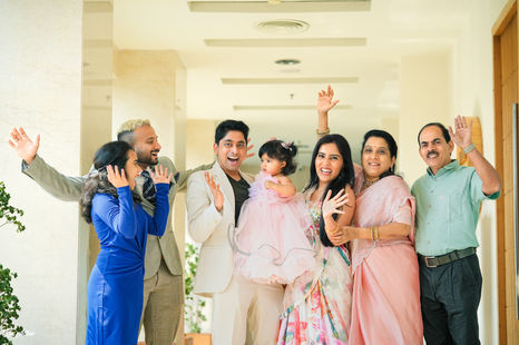 Family group photo during 1st birthday celebration in Vizag

