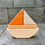 Thumbnail: Wooden toy boat with orange sail on gray steps, Serenitoys Goliath Wooden Blocks.